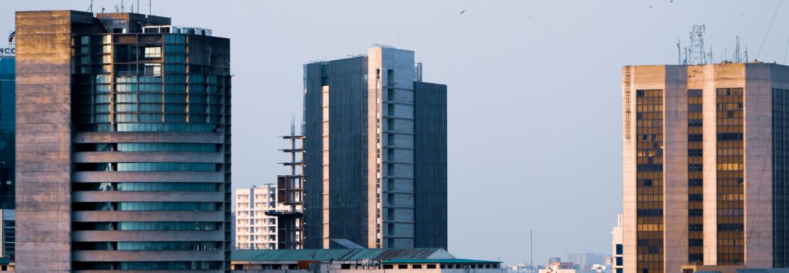 A side-by-side comparison chart of Alpha 1 and Gamma 1 in Greater Noida, detailing key factors like average property prices, connectivity, amenities