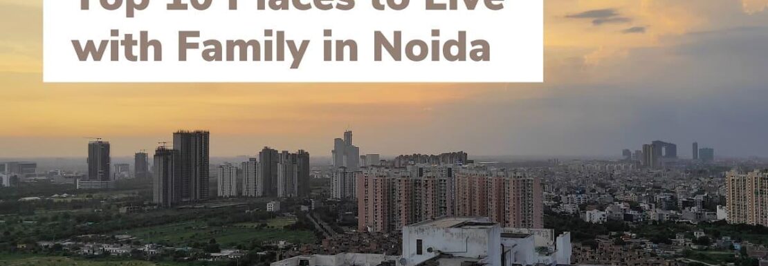 An aerial view of a well-planned, green residential sector in Greater Noida with wide roads and modern buildings.