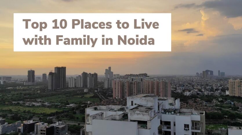 An aerial view of a well-planned, green residential sector in Greater Noida with wide roads and modern buildings.